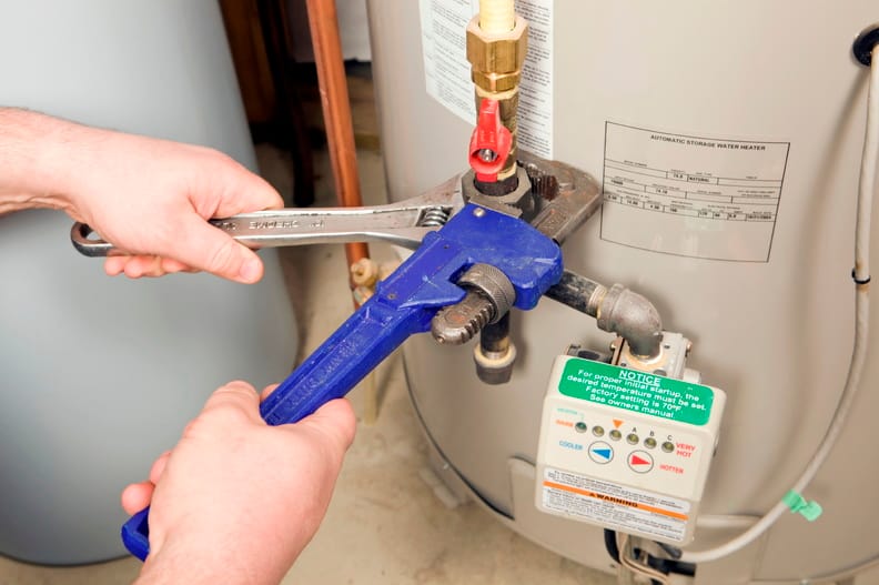 Plumber repairing a water heater valve in Hollywood
